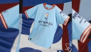 Manchester City - Heimtrikot: Erling Haalands erstes Trikot bei den Citizens ist weiter in Skyblue gehalten, hat nun aber einen auffälligen rot-weißen Kragen und Ärmelenden. Es ist eine Hommage an die Colin-Bell-Ära Ende der 60er Jahre.